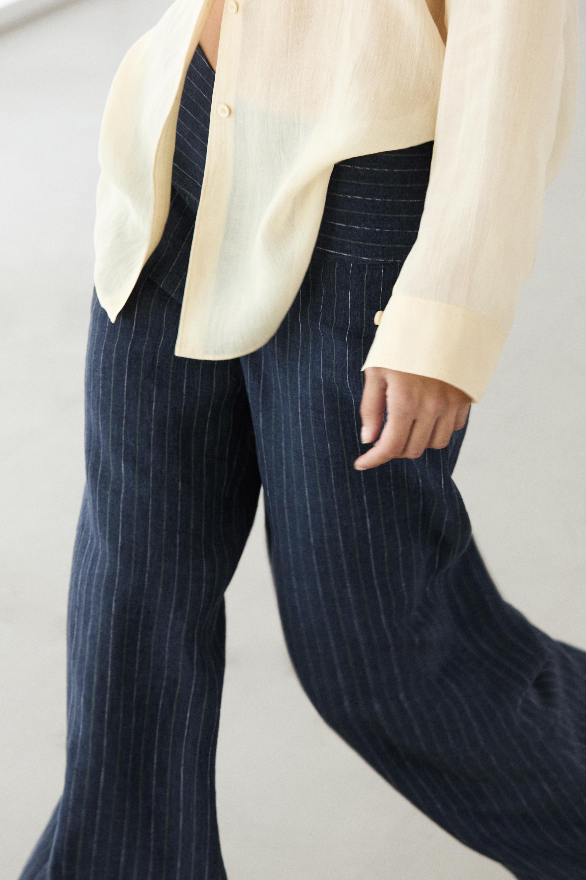 Flare fit linen trousers with striped details